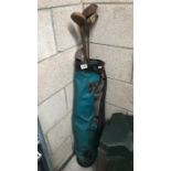 7 old golf clubs in bag