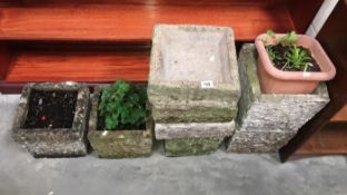 A quantity of concrete garden planters