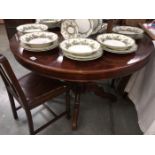 A circular extending inlaid dining table