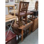 A set of 1930's oak dining chairs with formica dropside dining table