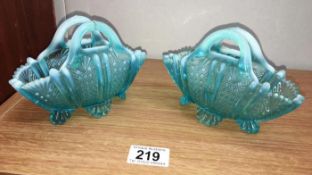 A pair of pale blue Victorian vaseline handbag vases