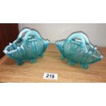 A pair of pale blue Victorian vaseline handbag vases