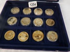 A cased set of 12 replica presentation crowns