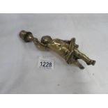 A brass cherub candlestick,