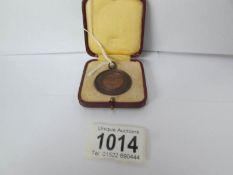 A Royal Life saving society medal awarded to M Nicholls,