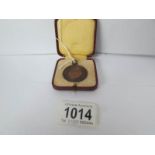 A Royal Life saving society medal awarded to M Nicholls,