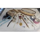A mixed lot of costume jewellery including gold ankle chain, ladies gold wrist watch,