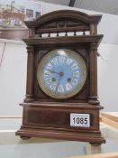 An Edwardian mantel clock with enamel dial,