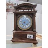 An Edwardian mantel clock with enamel dial,