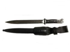 A military dagger with Nazi Germany SS Panzer emblem and scabbard