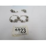 2 pairs of silver earrings,