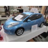 A Nissan main dealer car showroom model of a Nissan Leaf electric car,