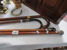 4 walking sticks including silver mounts,