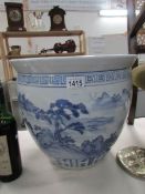 A large blue and white oriental jardiniere