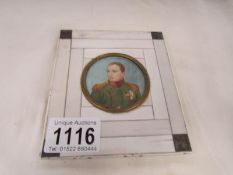 A framed miniature portrait of Napoleon