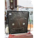 An arts and crafts copper and metal fire screen