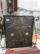 An arts and crafts copper and metal fire screen