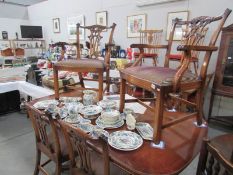 An extending mahogany dining table with 2 mahogany carver chairs and 4 mahogany dining chairs