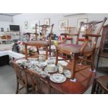 An extending mahogany dining table with 2 mahogany carver chairs and 4 mahogany dining chairs