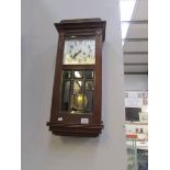 An oak wall clock