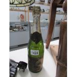 A bottle of vintage champagne - label badly deteriorated