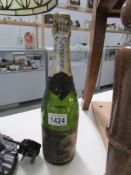 A bottle of vintage champagne - label badly deteriorated