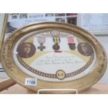 A framed and glazed set of 3 WW1 medals for the Battle of Verdun in oval frame