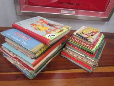 A collection of vintage children's books and annuals including Toby Twirl Tales,
