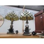 A pair of table lamps with Tiffany style shades