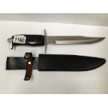 A hunting knife marked 'Stainless China' complete with scabbard