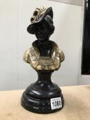 A stylish brass/bronze bust of a lady on plinth