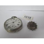 A pocket watch and a Victorian coin brooch