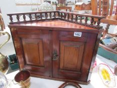 A Victorian hanging corner wall cupboard