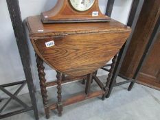 An oak barley twist gate leg table