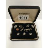 A cased set of cuff links with matching collar studs set with seed pearls and another pair of cuff