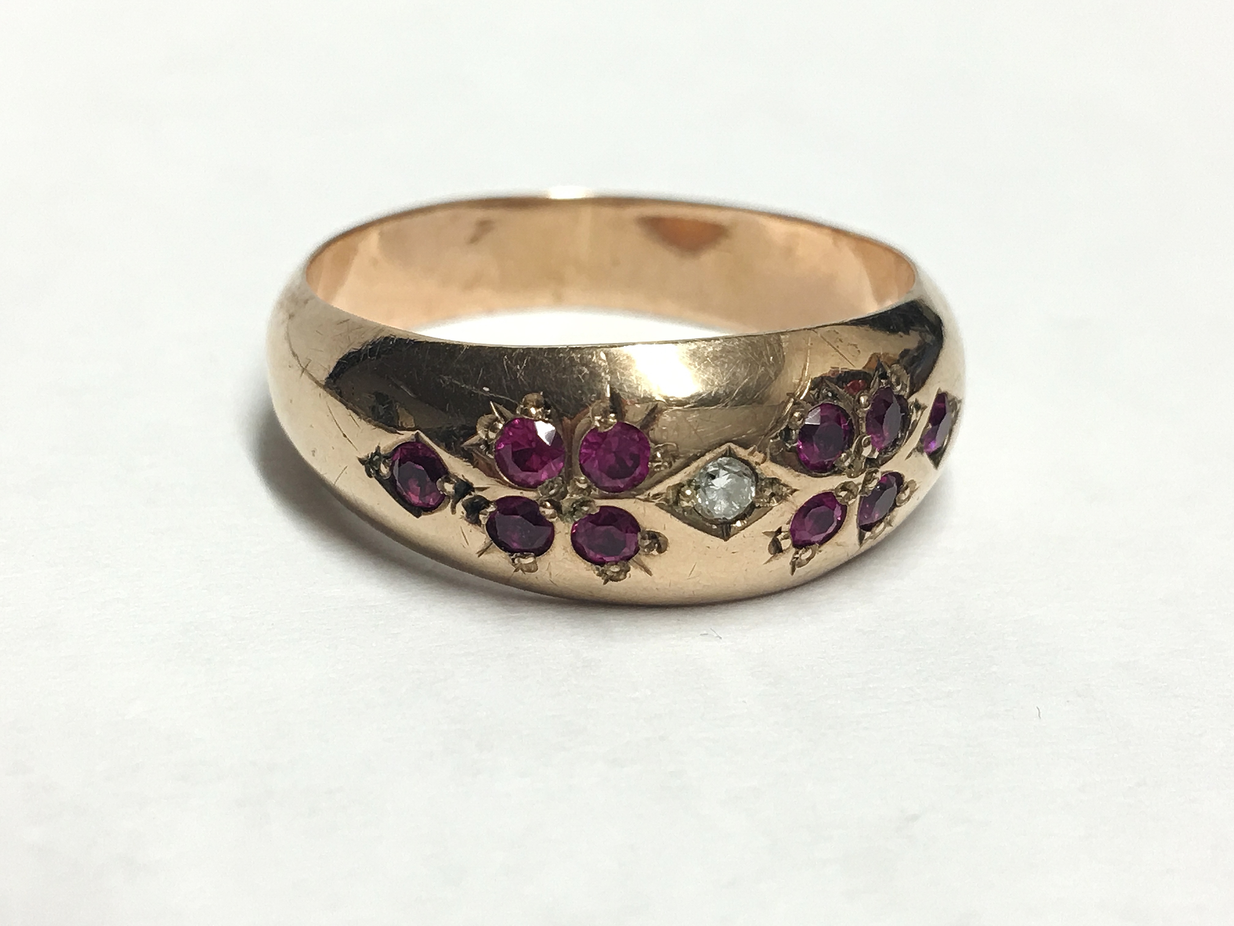 A diamond and ruby set 9ct gold ring,