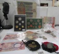 A mixed lot of world coins including Canada, India etc together with bank notes from Nigeria,
