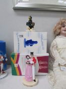 A Royal Doulton Quality Street couple and Pick up a penguin figures (boxed with certificates)