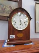 A Comitti inlaid mantel clock with Westminster chime and key