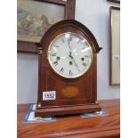 A Comitti inlaid mantel clock with Westminster chime and key