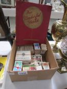 A box and album of cigarette cards