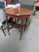 A mahogany side table with reeded legs