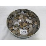 A tin of foreign coins