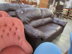 A dark brown leather sofa