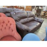 A dark brown leather sofa