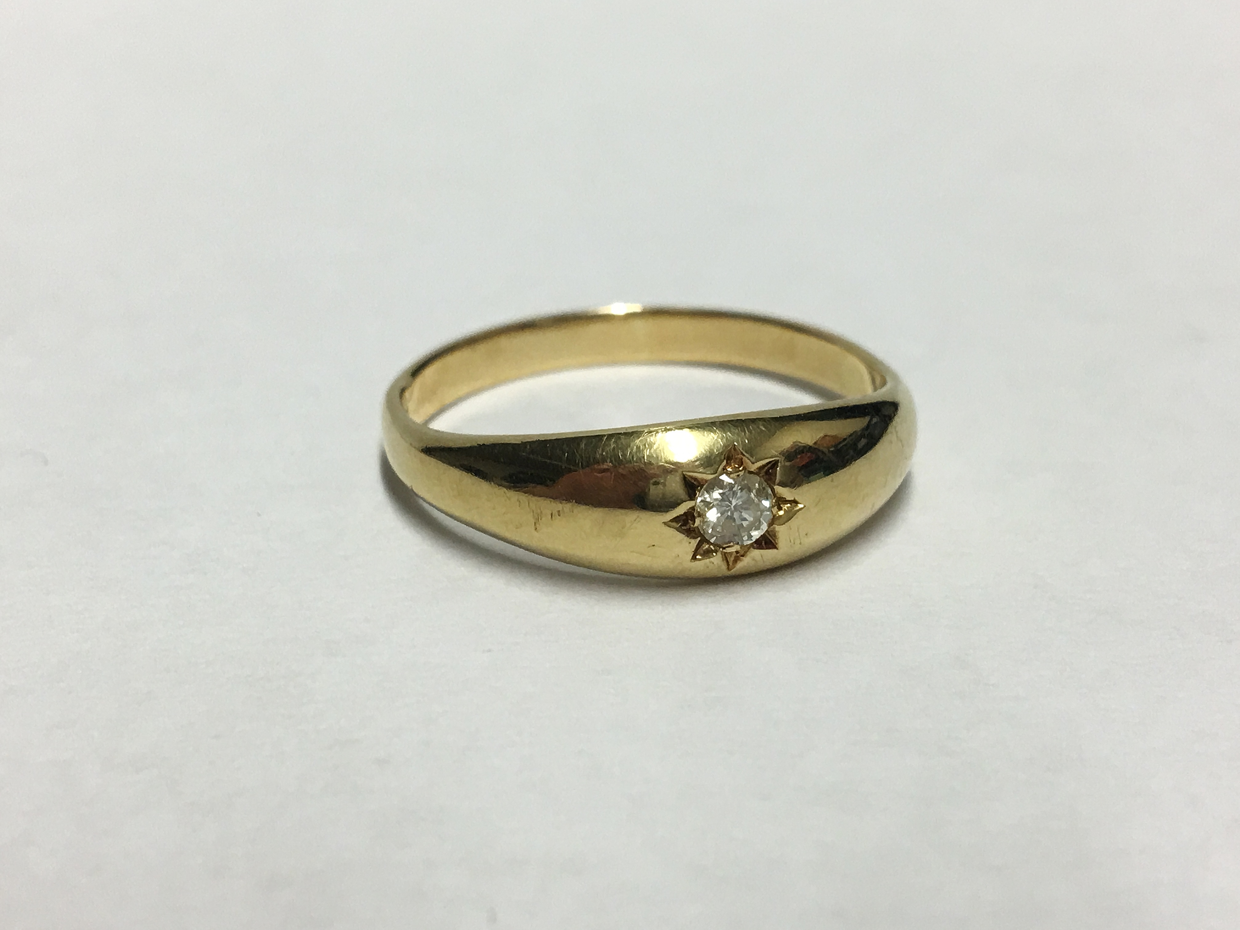 An 18ct gold diamond set ring dated London 1958