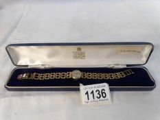 A 9ct gold ladies accurist wrist watch on 9ct gold strap