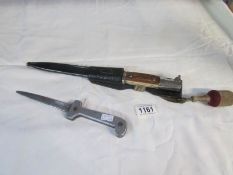 A German style bayonet with scabbard and one other knife