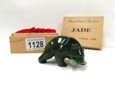 A boxed Cassiar jade figure of a polar bear with fish