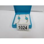 A pair of silver turquoise set earrings